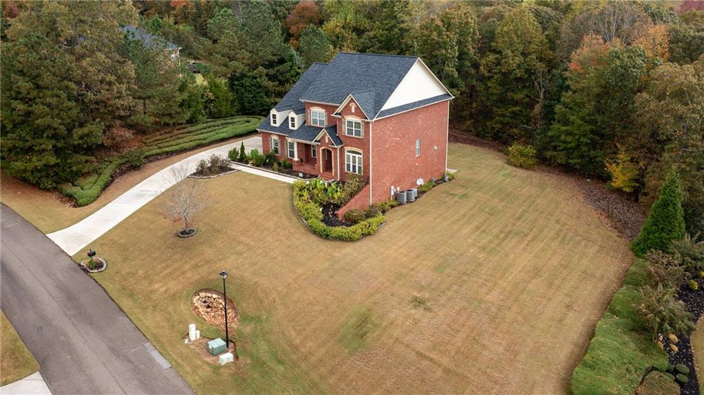 2220 Stirling Bridge Road Cumming, GA 30041 - Photo 3 of 82 a view of a house with a yard