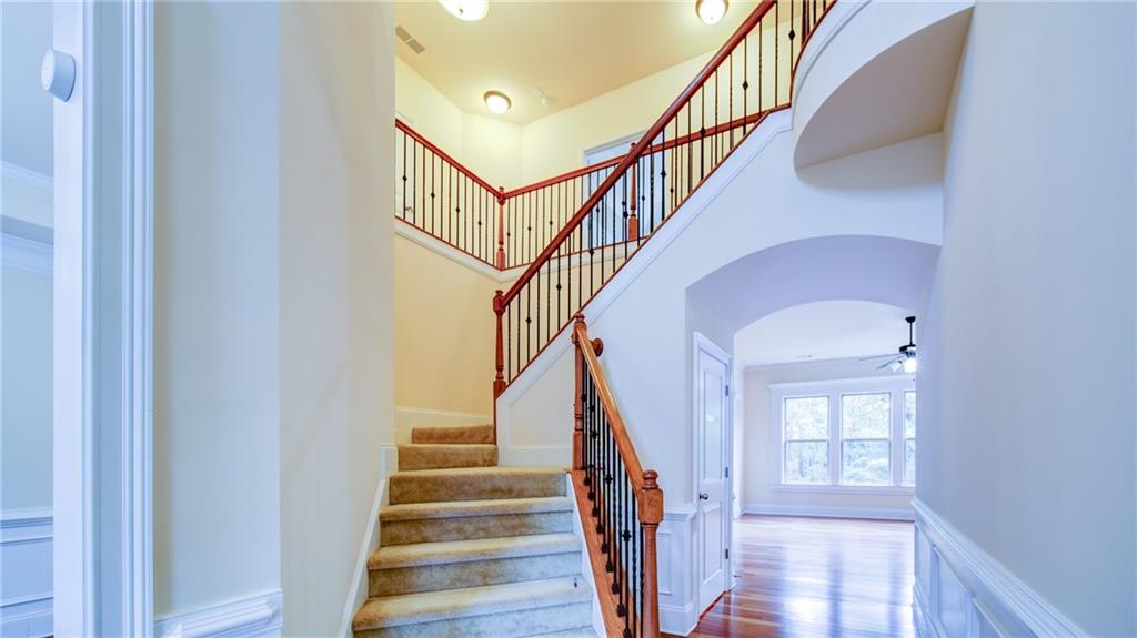 2220 Stirling Bridge Road Cumming, GA 30041 - Photo 33 of 82 a view of entryway and hall with wooden floor