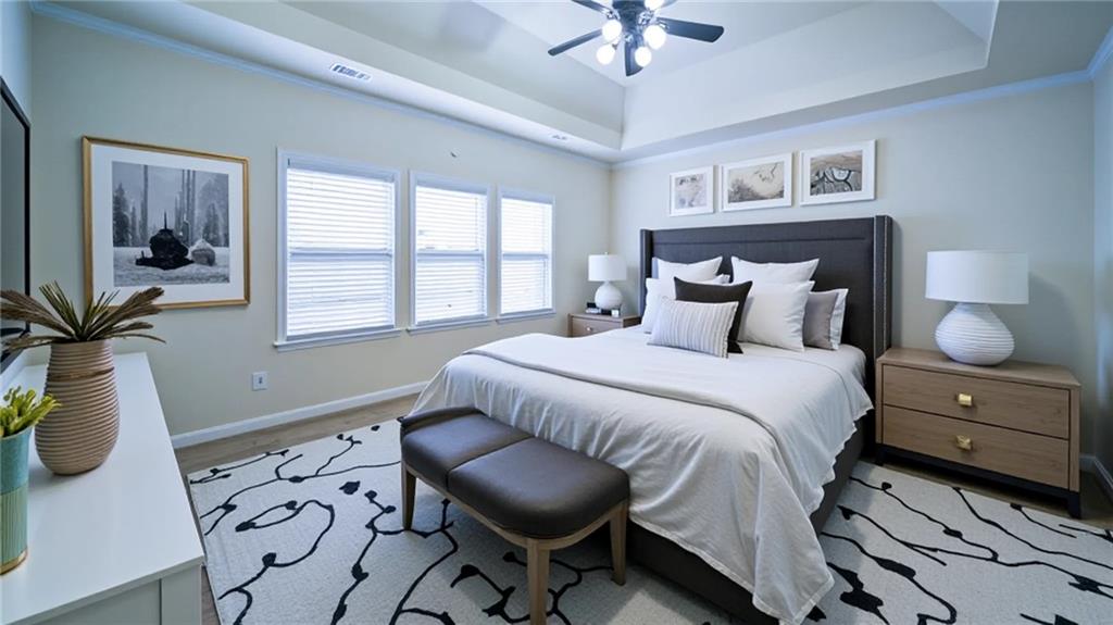 2220 Stirling Bridge Road Cumming, GA 30041 - Photo 40 of 82 a bedroom with a bed and wooden floor