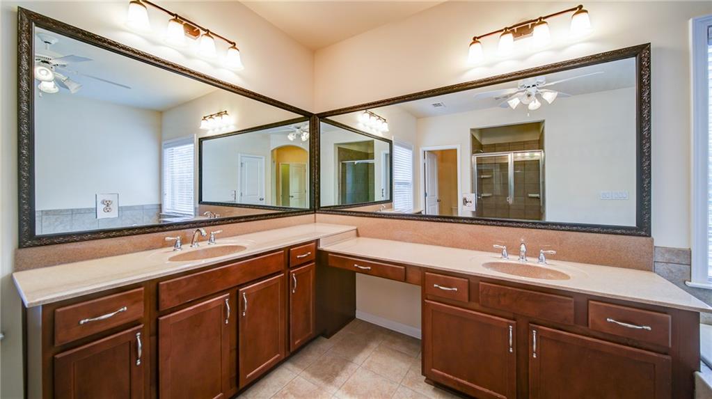 2220 Stirling Bridge Road Cumming, GA 30041 - Photo 44 of 82 a bathroom with a sink and a mirror