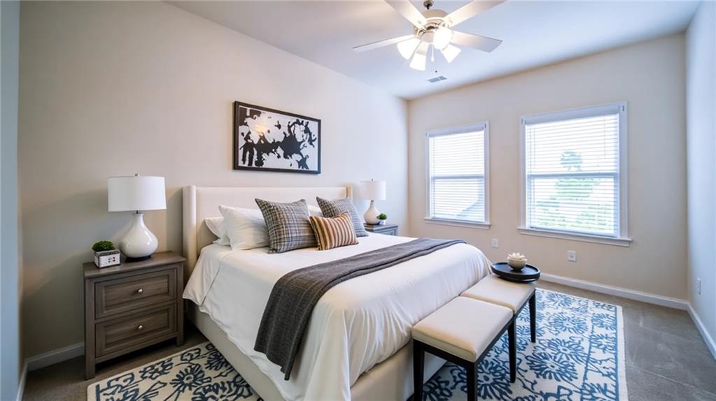 2220 Stirling Bridge Road Cumming, GA 30041 - Photo 46 of 82 a bed room with a bed and a chandelier