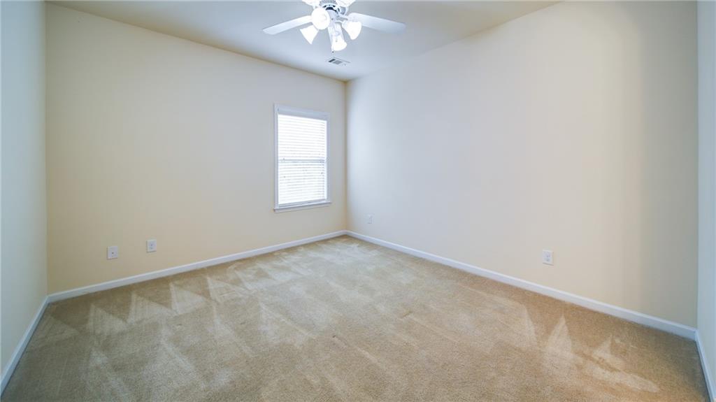 2220 Stirling Bridge Road Cumming, GA 30041 - Photo 47 of 82 wooden floor in an empty room with a window