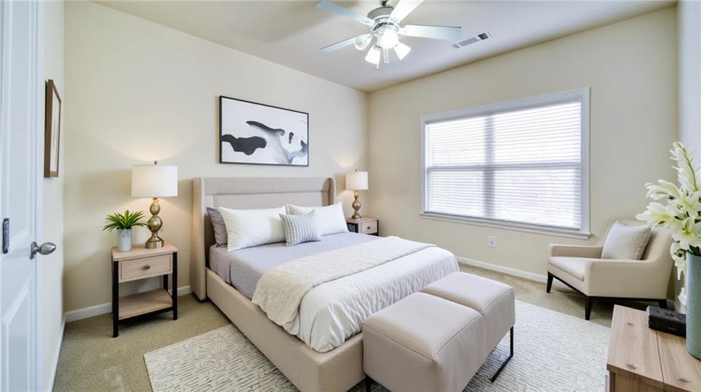 2220 Stirling Bridge Road Cumming, GA 30041 - Photo 53 of 82 a bedroom with a bed and a couch