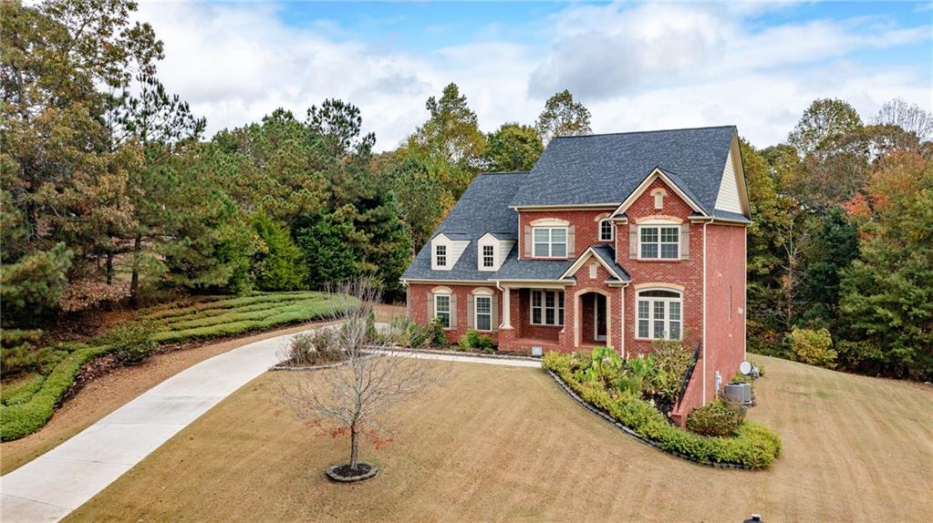 2220 Stirling Bridge Road Cumming, GA 30041 - Photo 73 of 82 a front view of a house with a yard