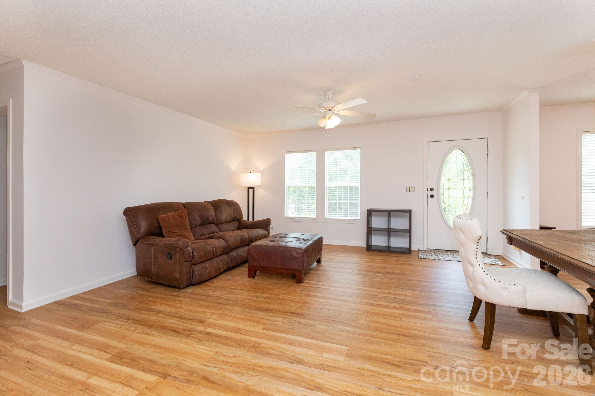 16 Rusty Clay Ridge Fairview, NC 28730 - Photo 12 of 19 a living room with furniture rug and wooden floor