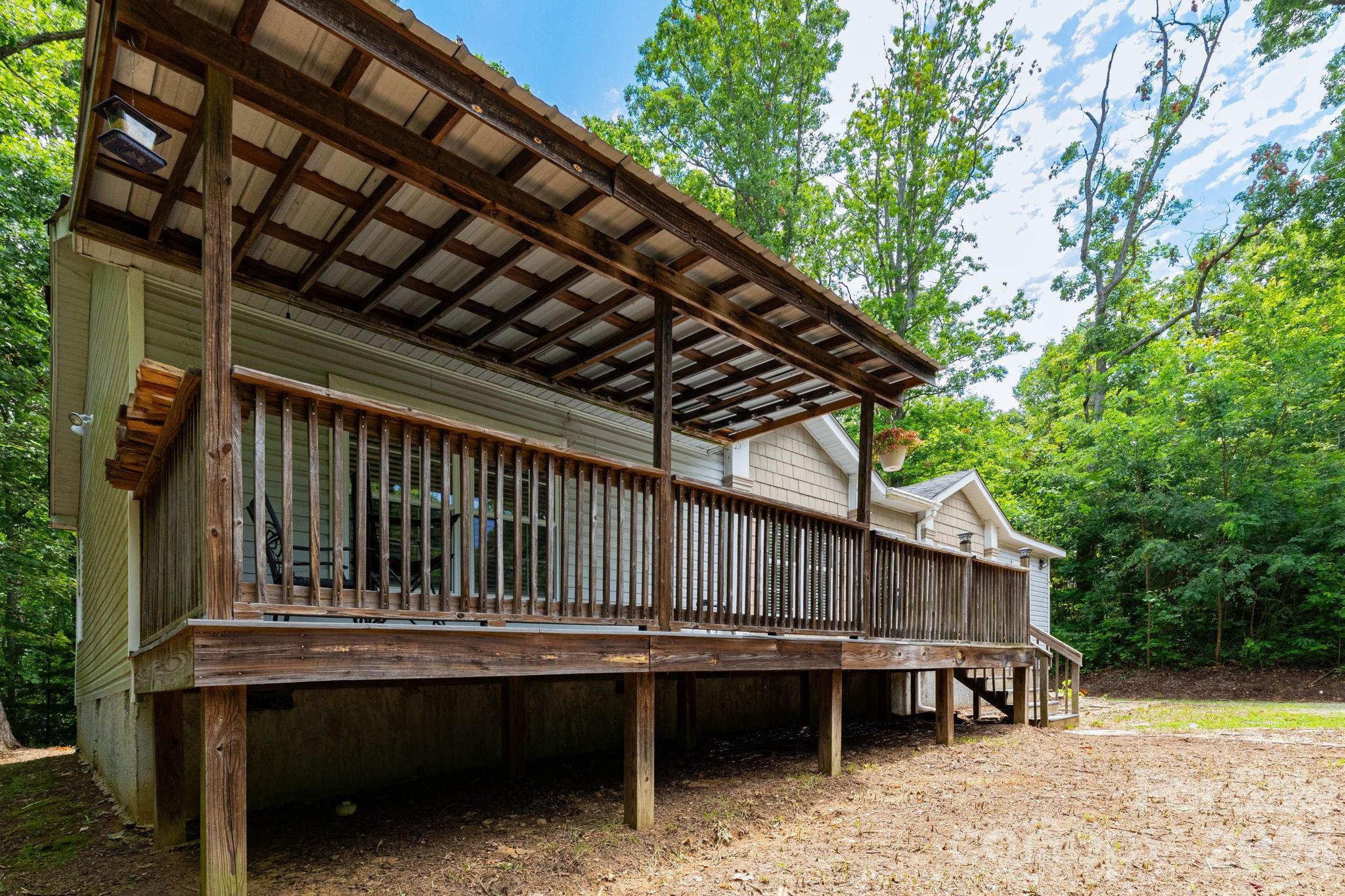 16 Rusty Clay Ridge Fairview, NC 28730 - Photo 4 of 19 a view of backyard with barbeque grill and outdoor seating