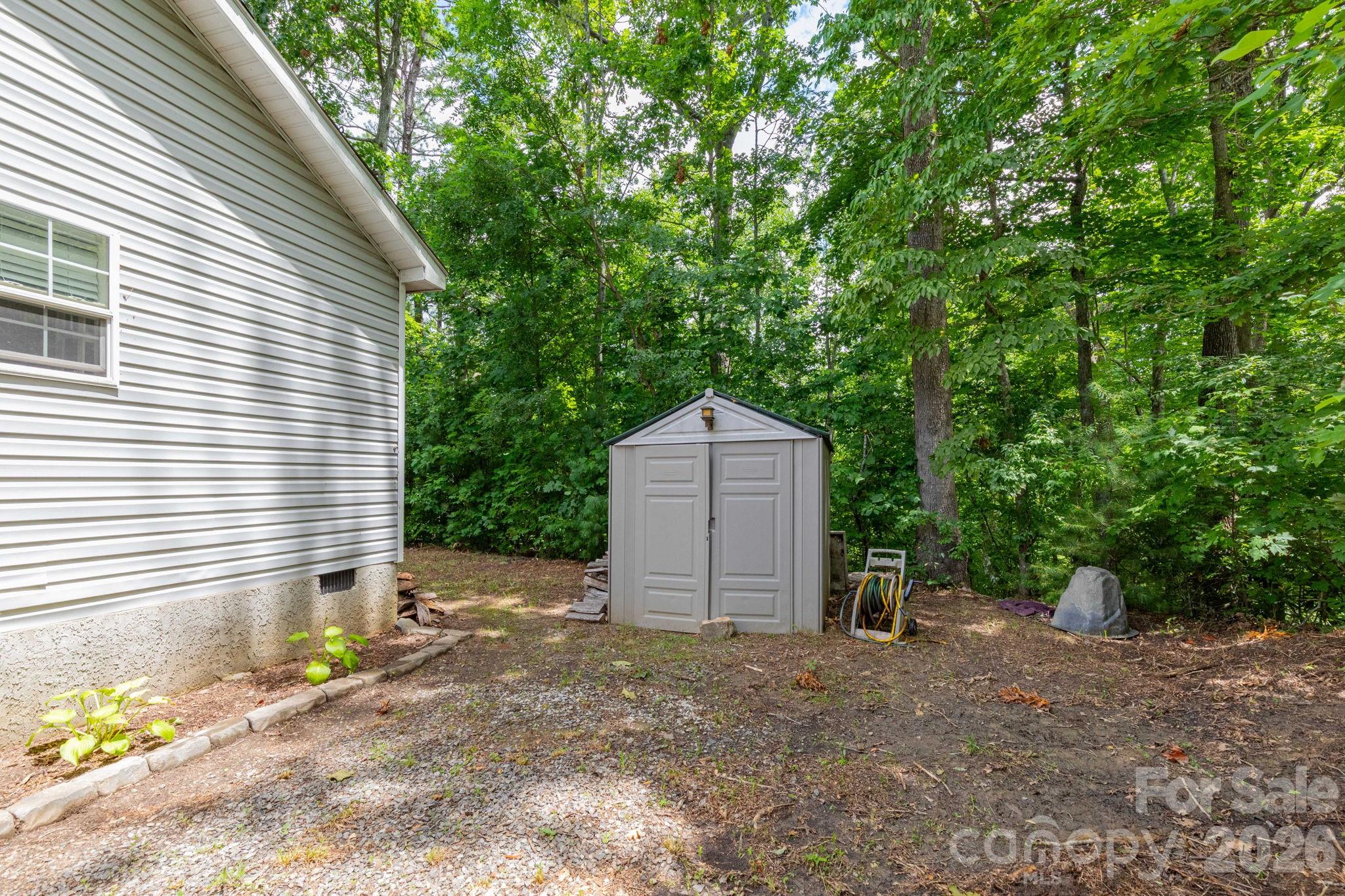 16 Rusty Clay Ridge Fairview, NC 28730 - Photo 7 of 19 a view of a house with a yard and large tree