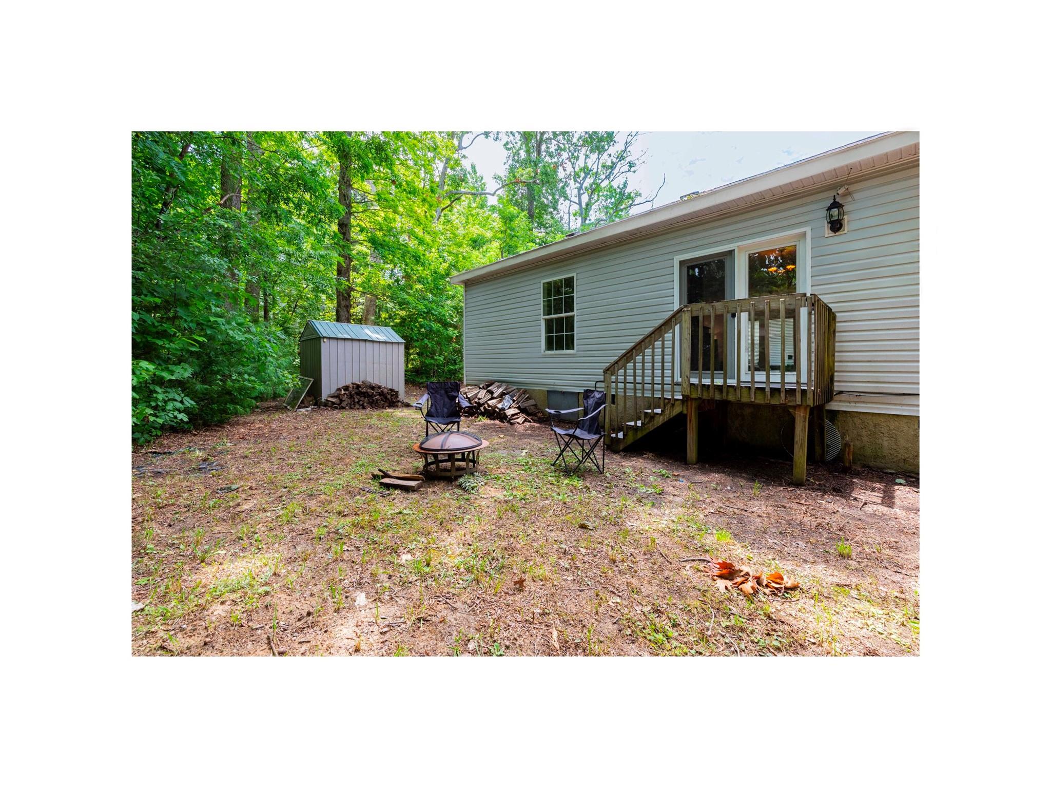 16 Rusty Clay Ridge Fairview, NC 28730 - Photo 8 of 19 a view of backyard with wooden fence