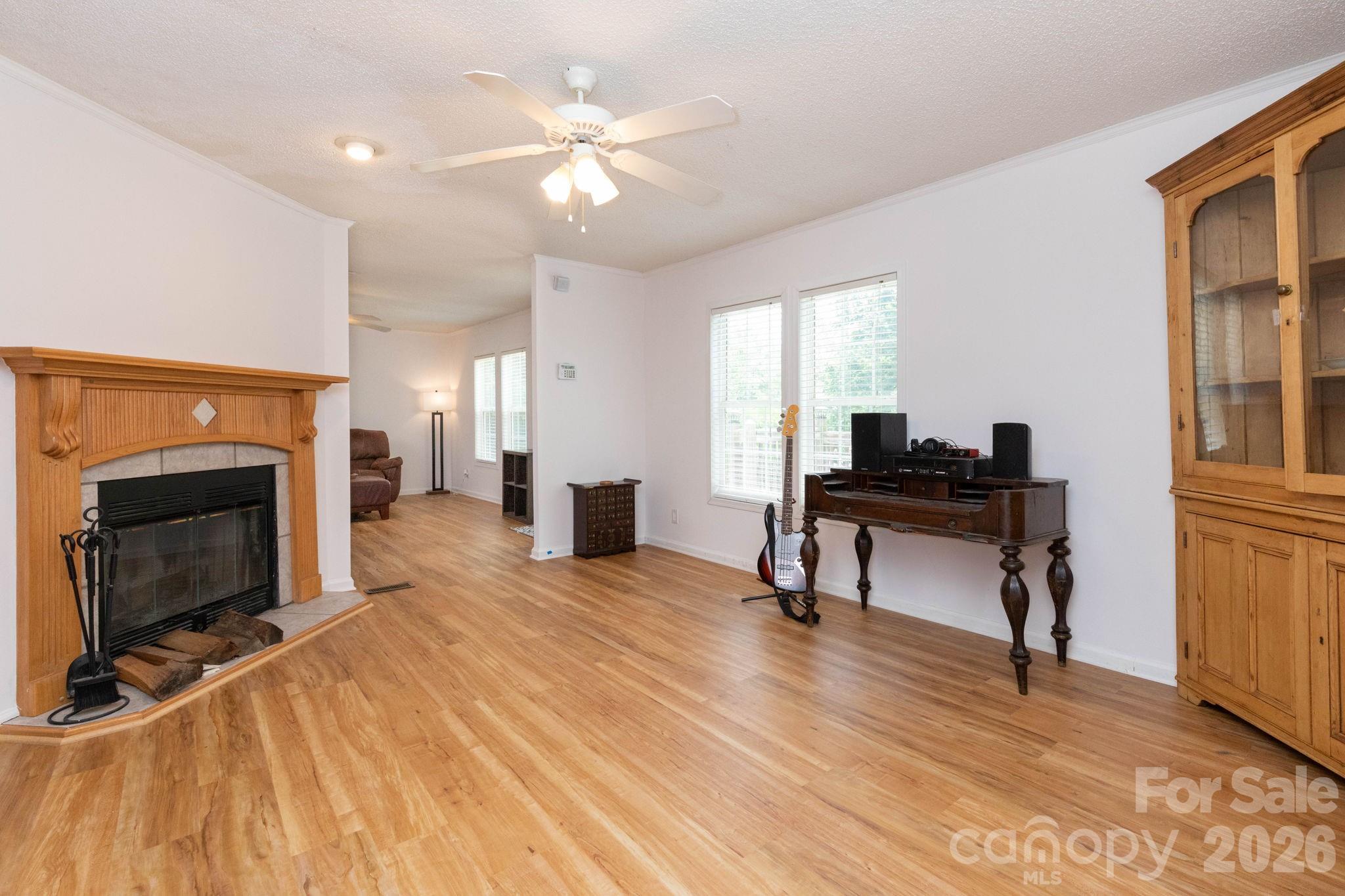 16 Rusty Clay Ridge Fairview, NC 28730 - Photo 10 of 19 a view of a livingroom with furniture and a fireplace