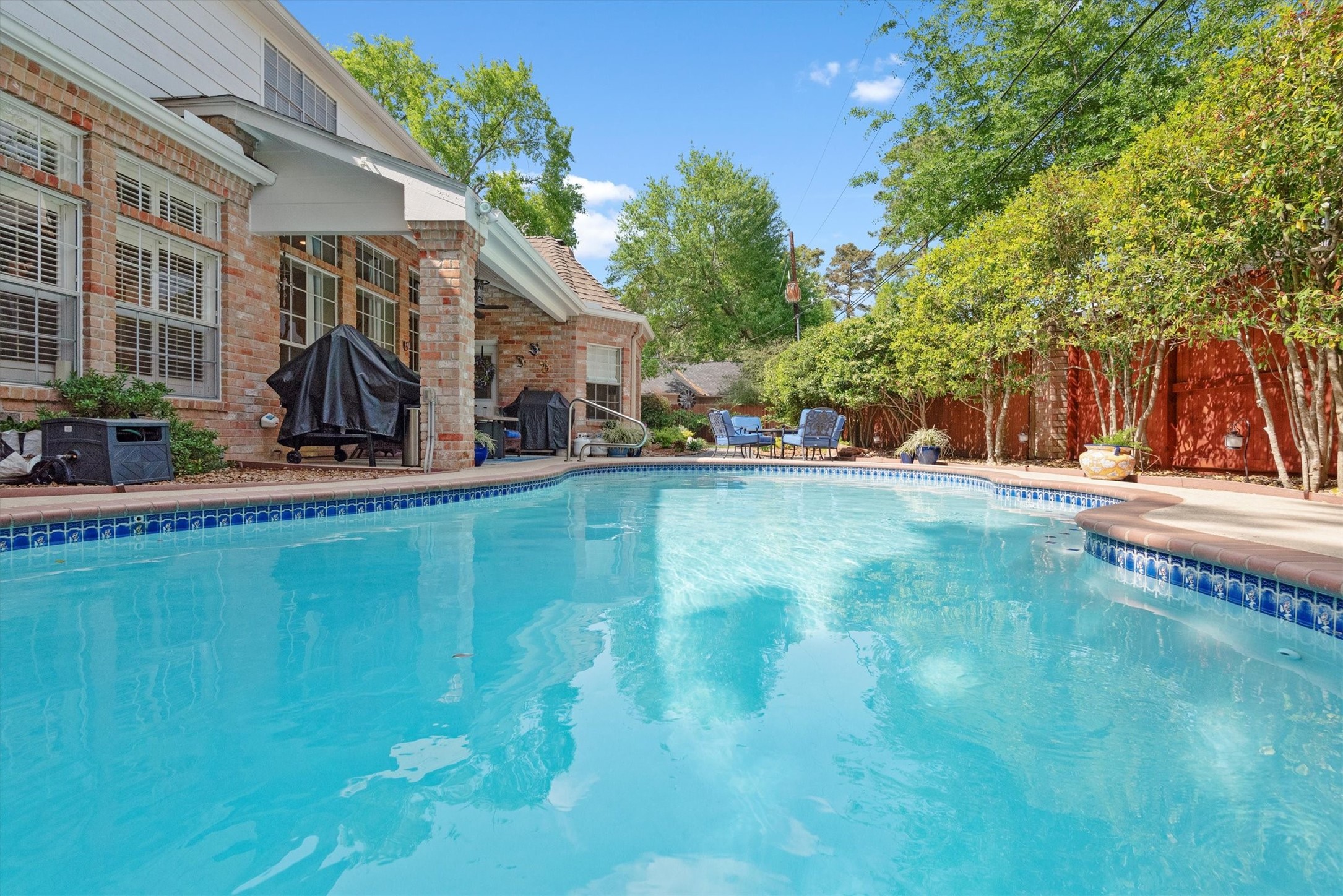 16022 Stewarts Grove Drive Spring, TX 77379 - Photo 1 of 45 a view of yard with swimming pool and sitting area