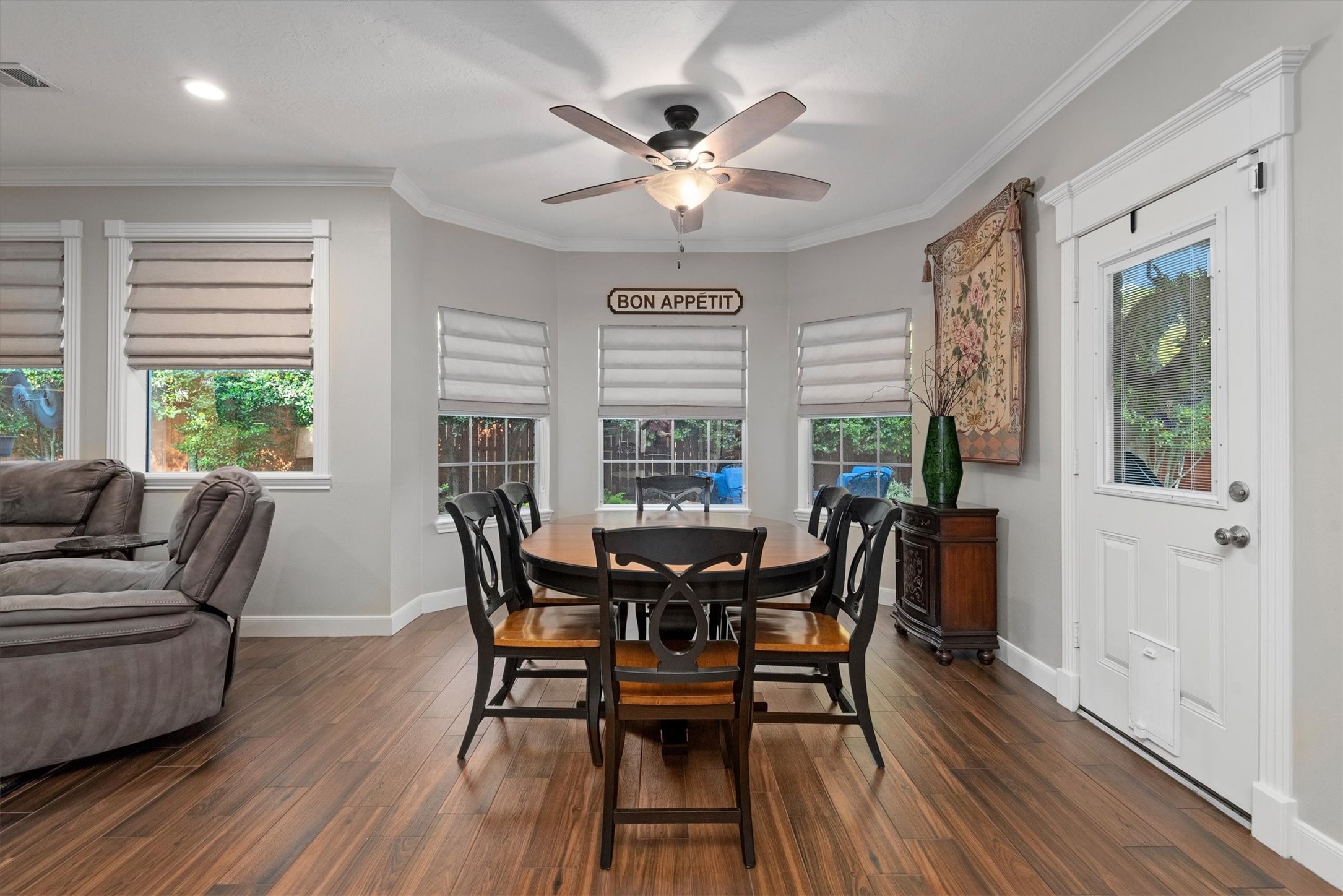 16022 Stewarts Grove Drive Spring, TX 77379 - Photo 16 of 45 a view of a dining room with furniture window and wooden floor