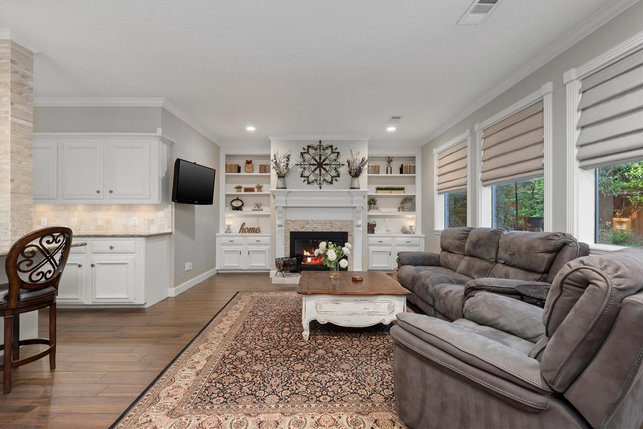 16022 Stewarts Grove Drive Spring, TX 77379 - Photo 20 of 45 a living room with furniture and a fireplace