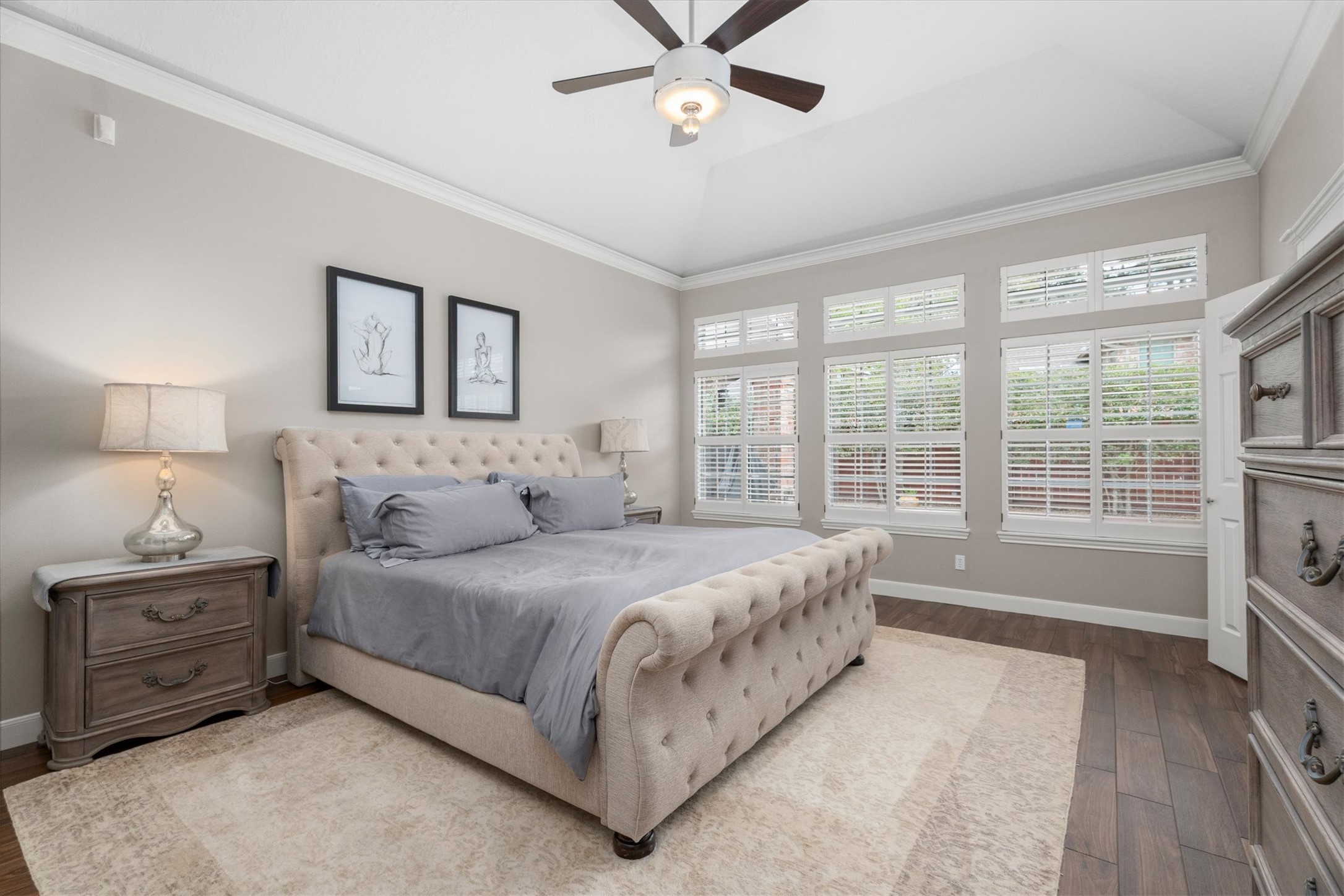 16022 Stewarts Grove Drive Spring, TX 77379 - Photo 22 of 45 a spacious bedroom with a bed and a cabinets
