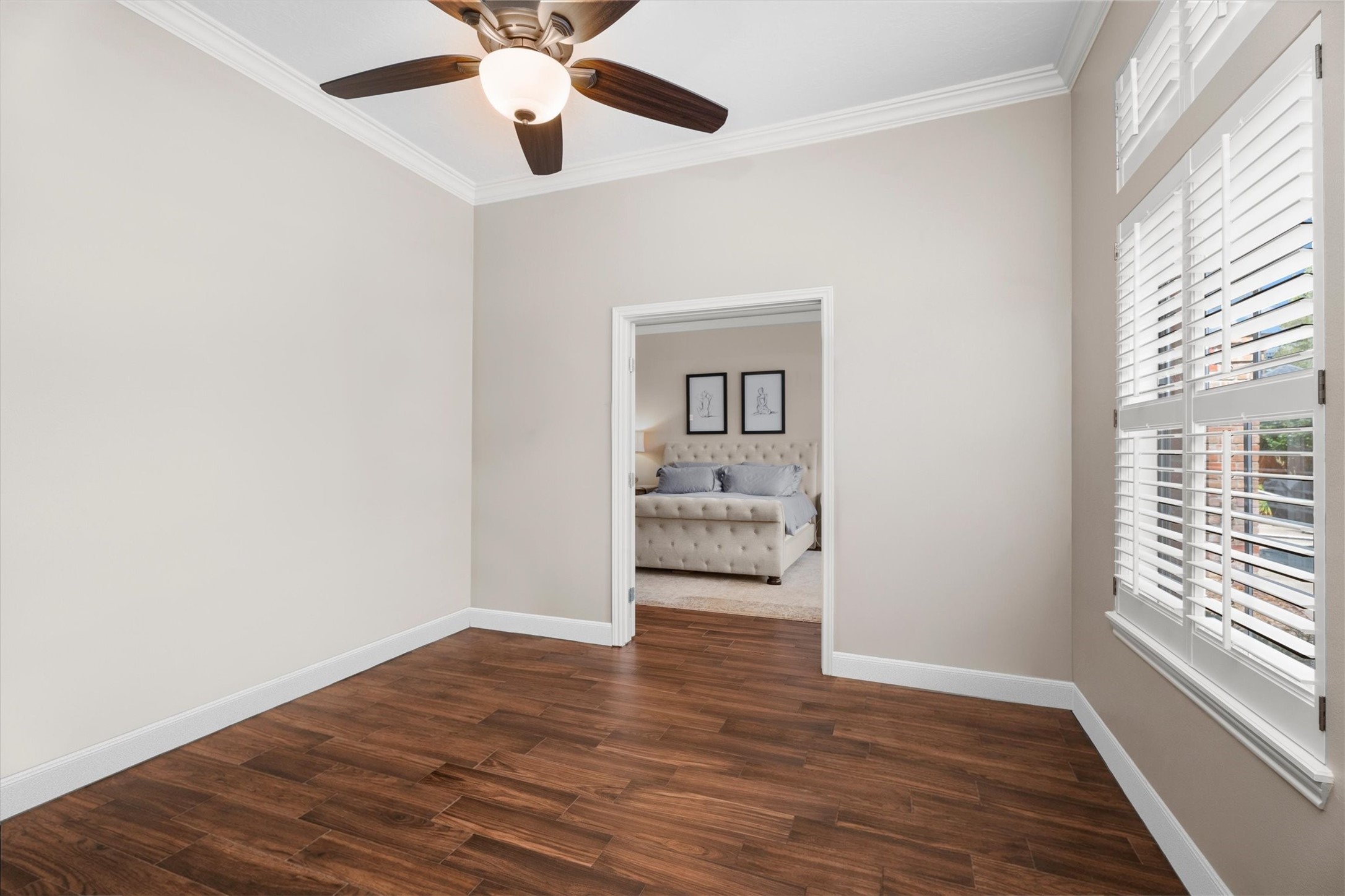 16022 Stewarts Grove Drive Spring, TX 77379 - Photo 24 of 45 a view of a livingroom with wooden floor and a ceiling fan