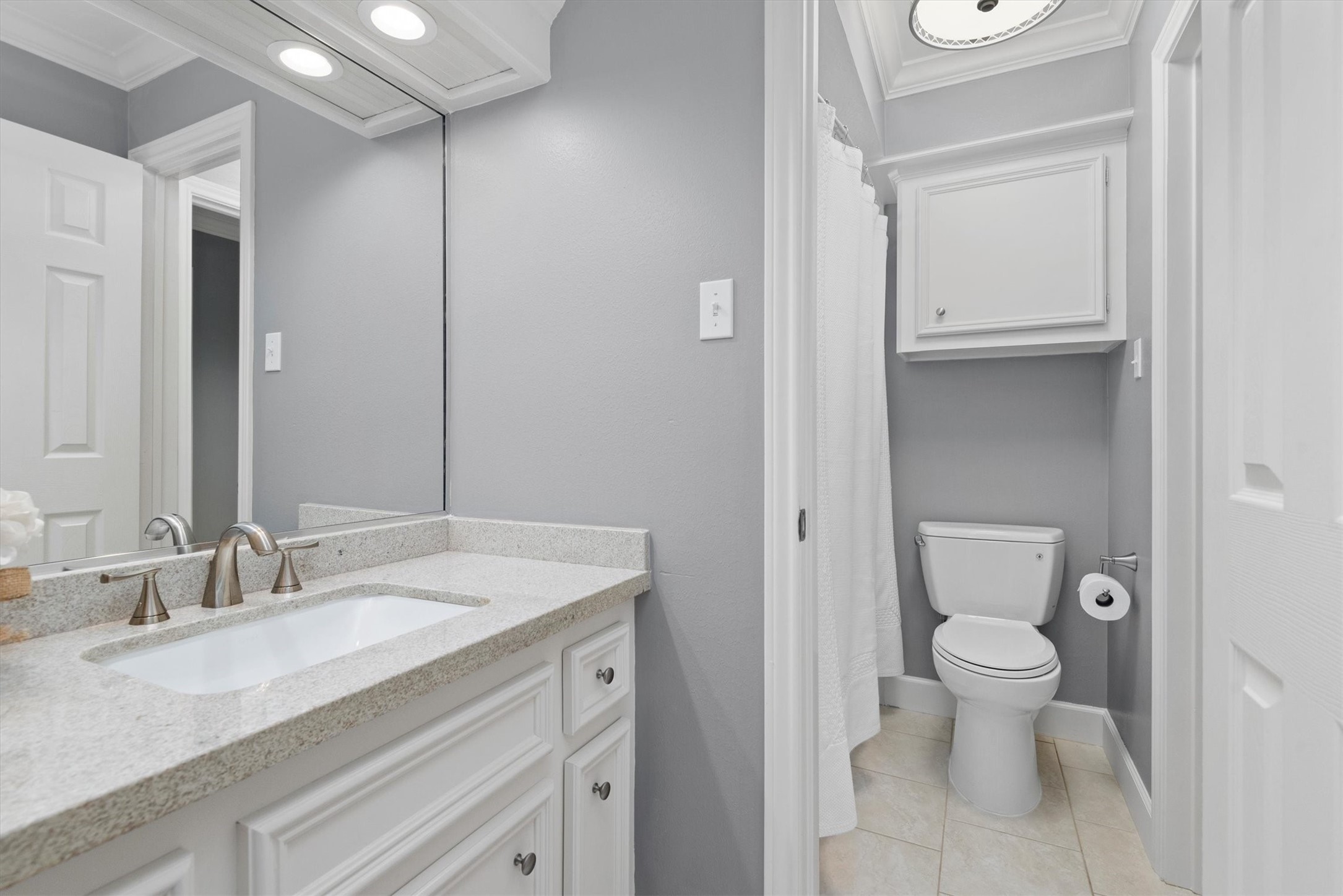 16022 Stewarts Grove Drive Spring, TX 77379 - Photo 32 of 45 a bathroom with a sink a toilet and a mirror
