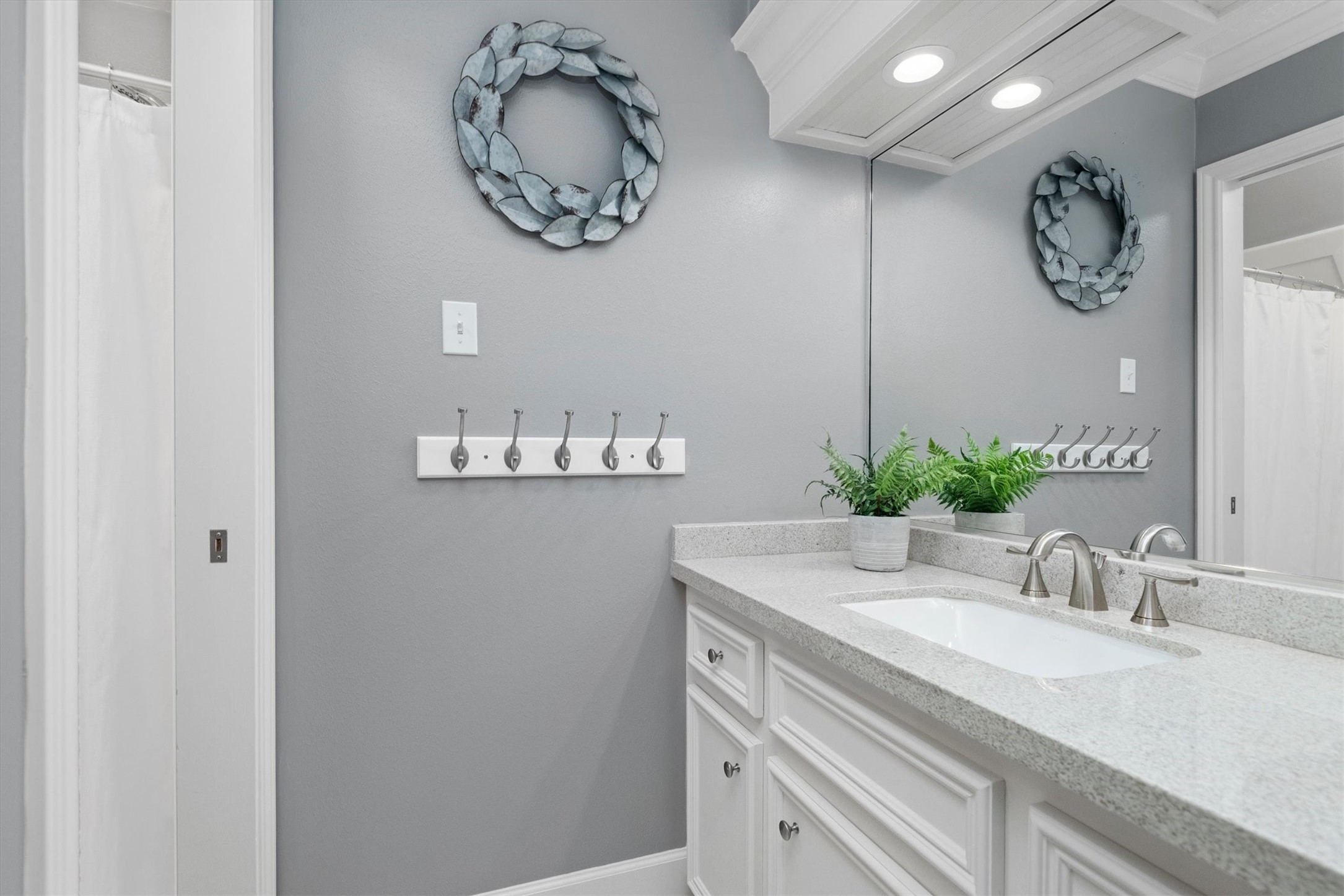 16022 Stewarts Grove Drive Spring, TX 77379 - Photo 36 of 45 a bathroom with a sink and a mirror