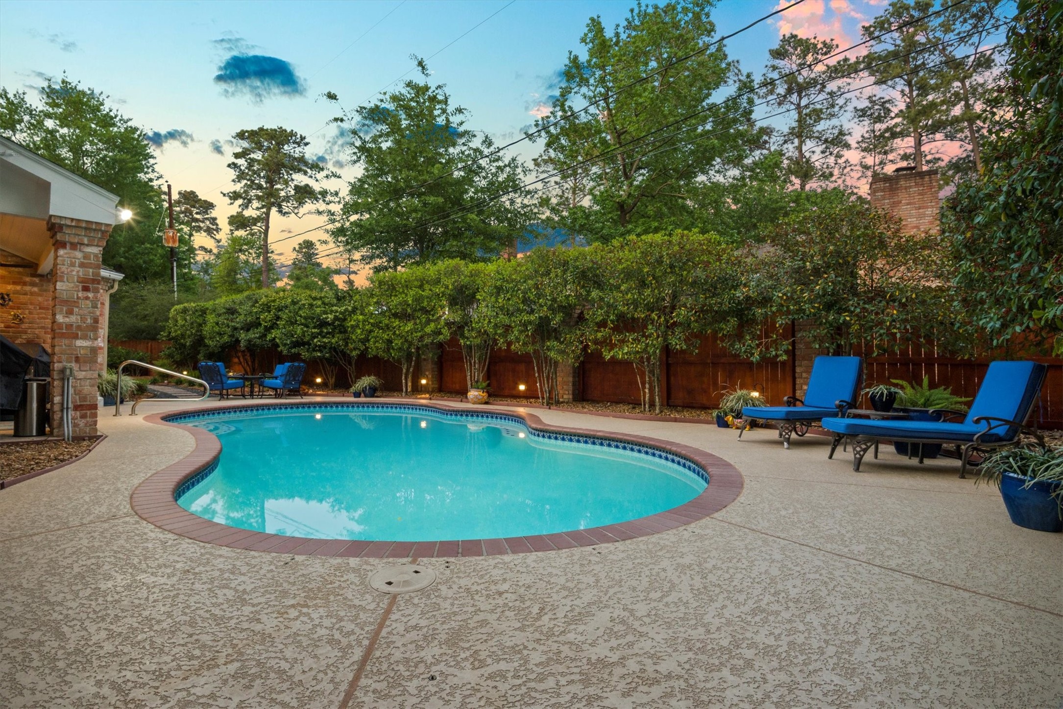 16022 Stewarts Grove Drive Spring, TX 77379 - Photo 38 of 45 a view of a swimming pool with a yard and sitting area