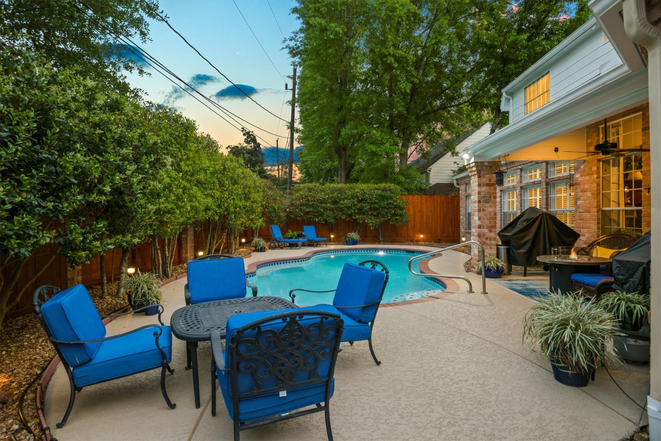 16022 Stewarts Grove Drive Spring, TX 77379 - Photo 40 of 45 BACKYARD: Another view of the pool area showcases the mature landscaping that offers privacy and shade.