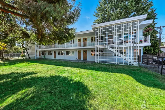 a front view of a house with a garden