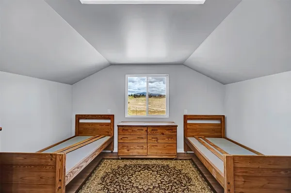 a hallway with a piano and wooden floor
