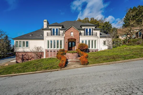 a front view of a house with a yard