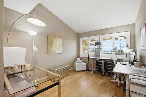 a bathroom with a granite countertop sink toilet a large mirror and a shower