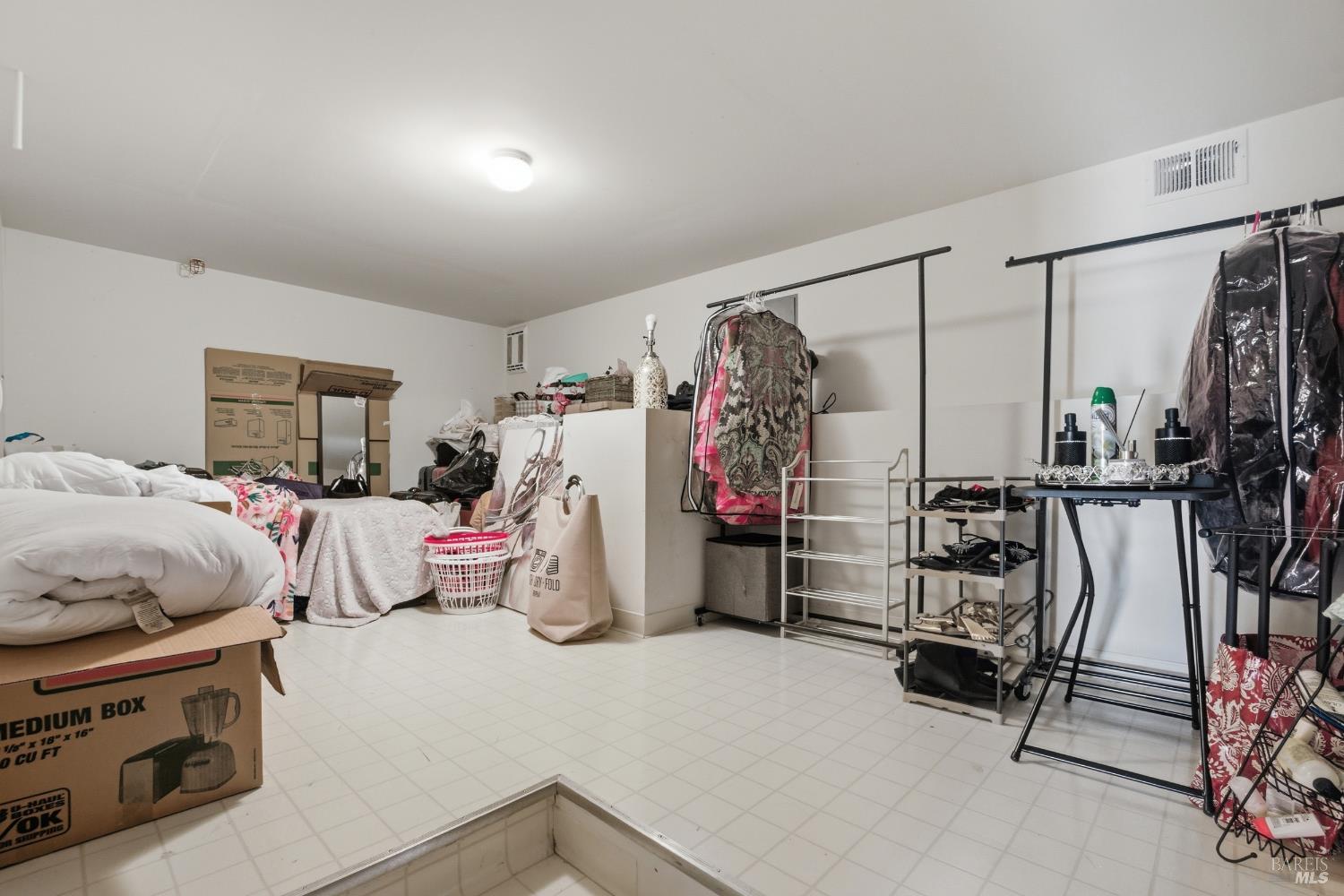 2003 Stonefield Lane Santa Rosa, CA 95403 - Photo 23 of 25 a bedroom with furniture and a walk in closet