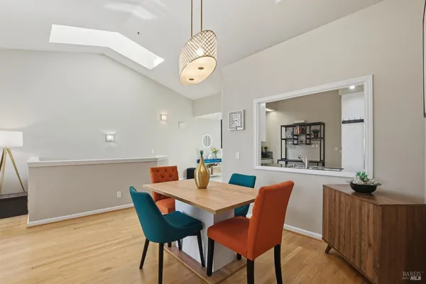 a dining room with furniture and wooden floor