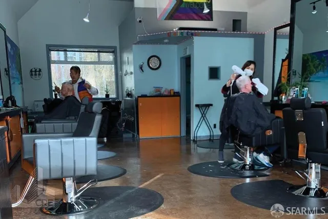 a living room with furniture and a mirror