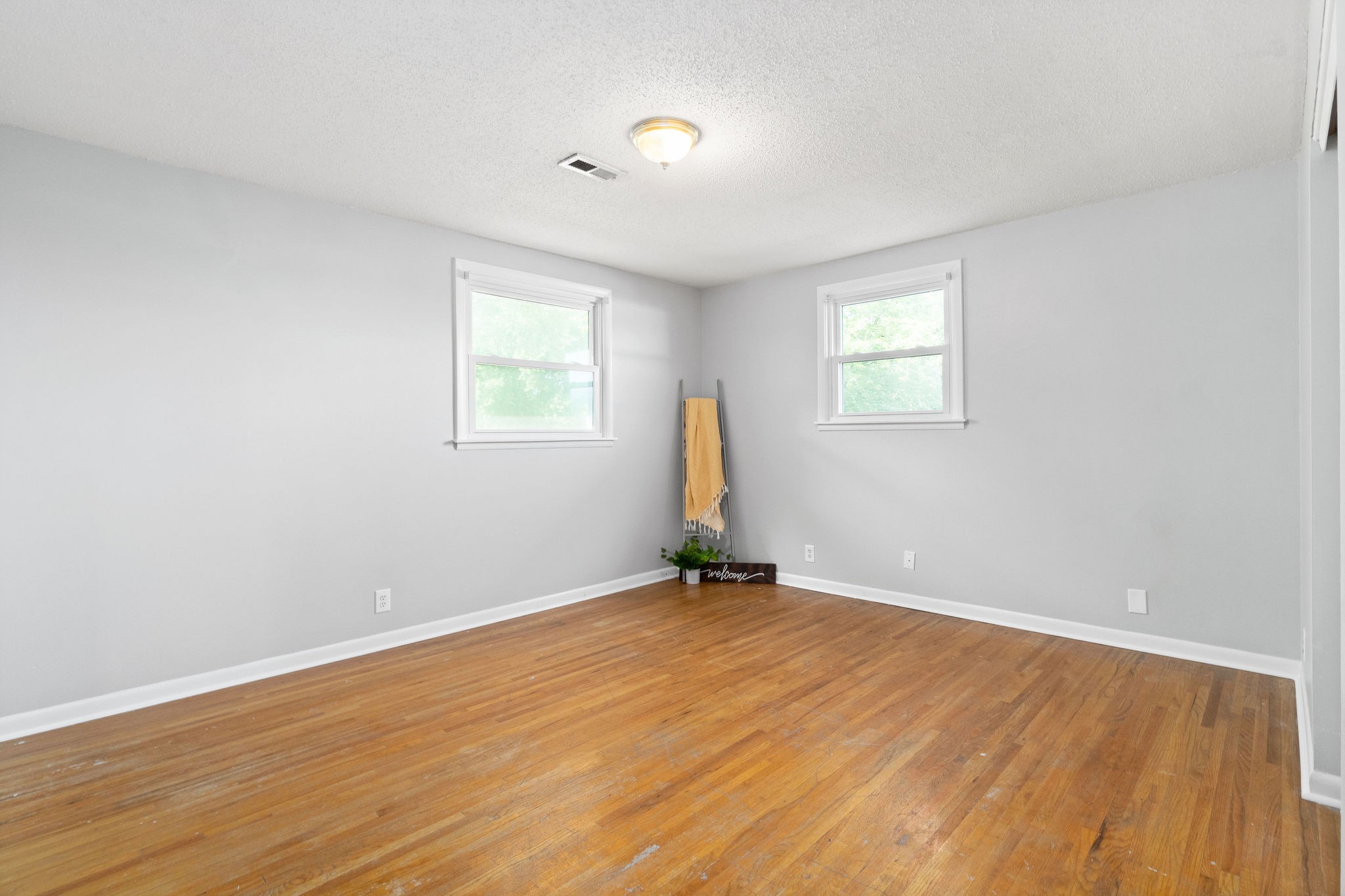 305 Copeland Road Clarksville, TN 37042 - Photo 22 of 29 an empty room with wooden floor and windows