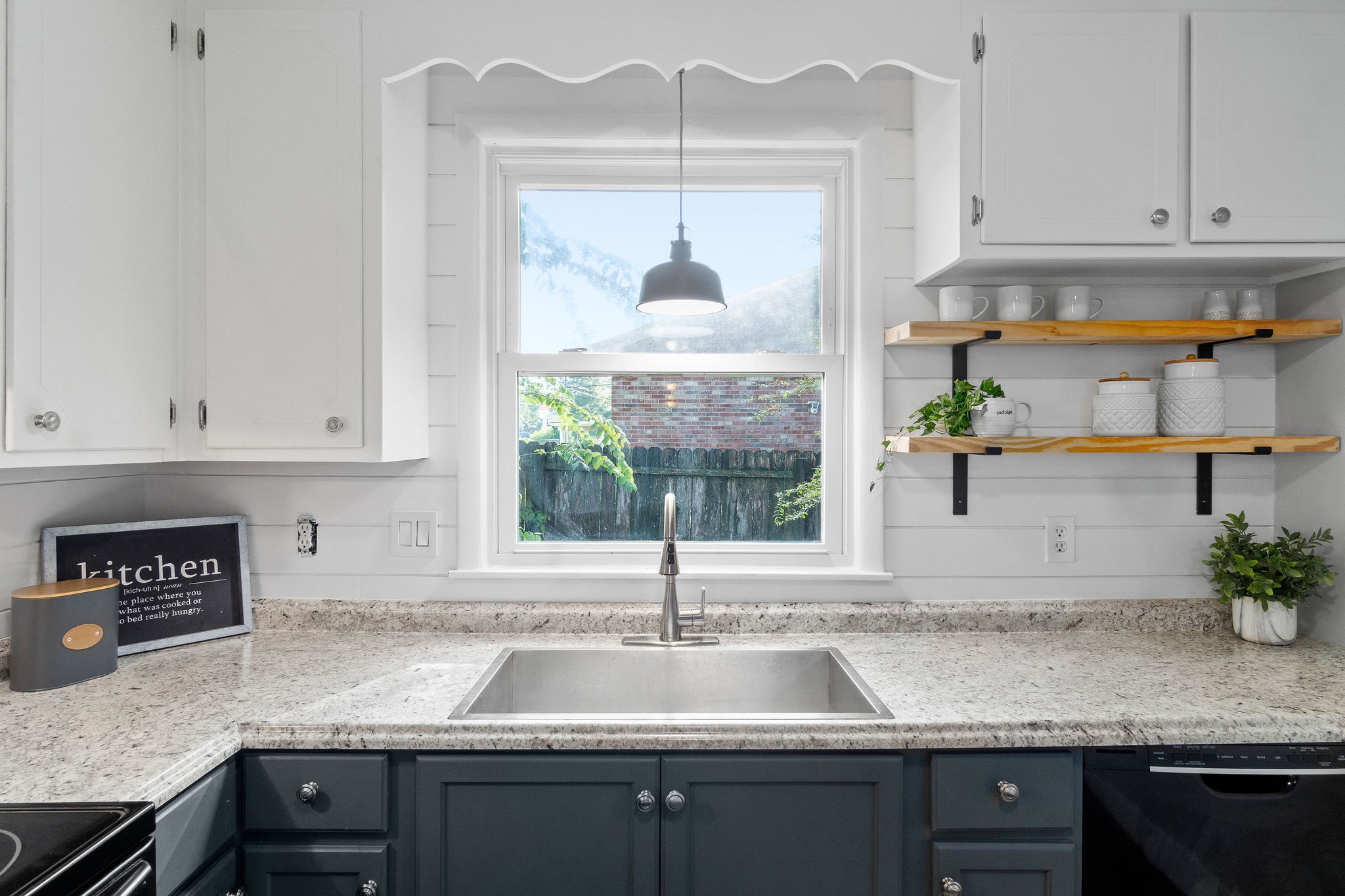 305 Copeland Road Clarksville, TN 37042 - Photo 8 of 29 a kitchen with granite countertop a sink and a stove