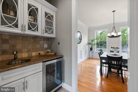 a view of a kitchen with a table and chairs