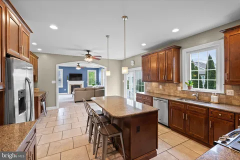 a kitchen with lots of counter top space and stainless steel appliances