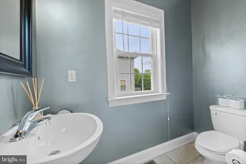 a bathroom with a sink a toilet and tub