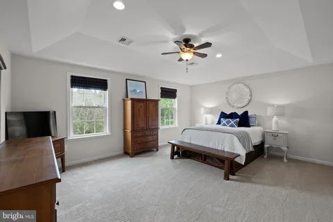 a bed room with a bed and a chandelier