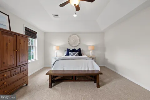 a view of a closet with wooden floor