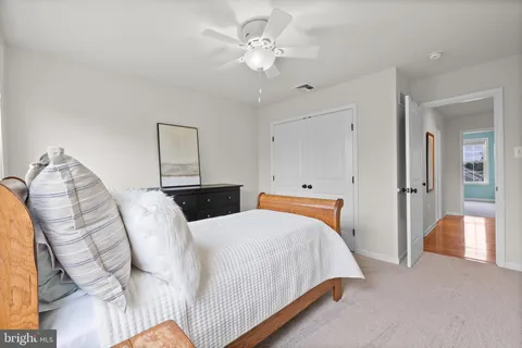 a bed room with a bed and a chandelier