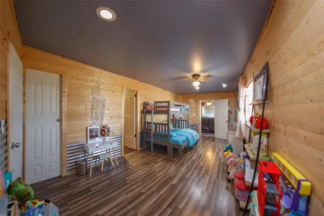 a view of dining room with wooden floor and furniture