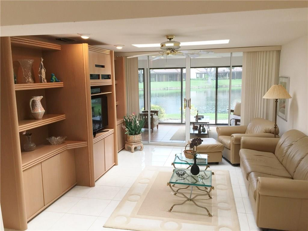 21925 Arriba Real, Unit 19A Boca Raton, FL 33433 - Photo 35 of 35 Family Room Facing Lanai & Lake
