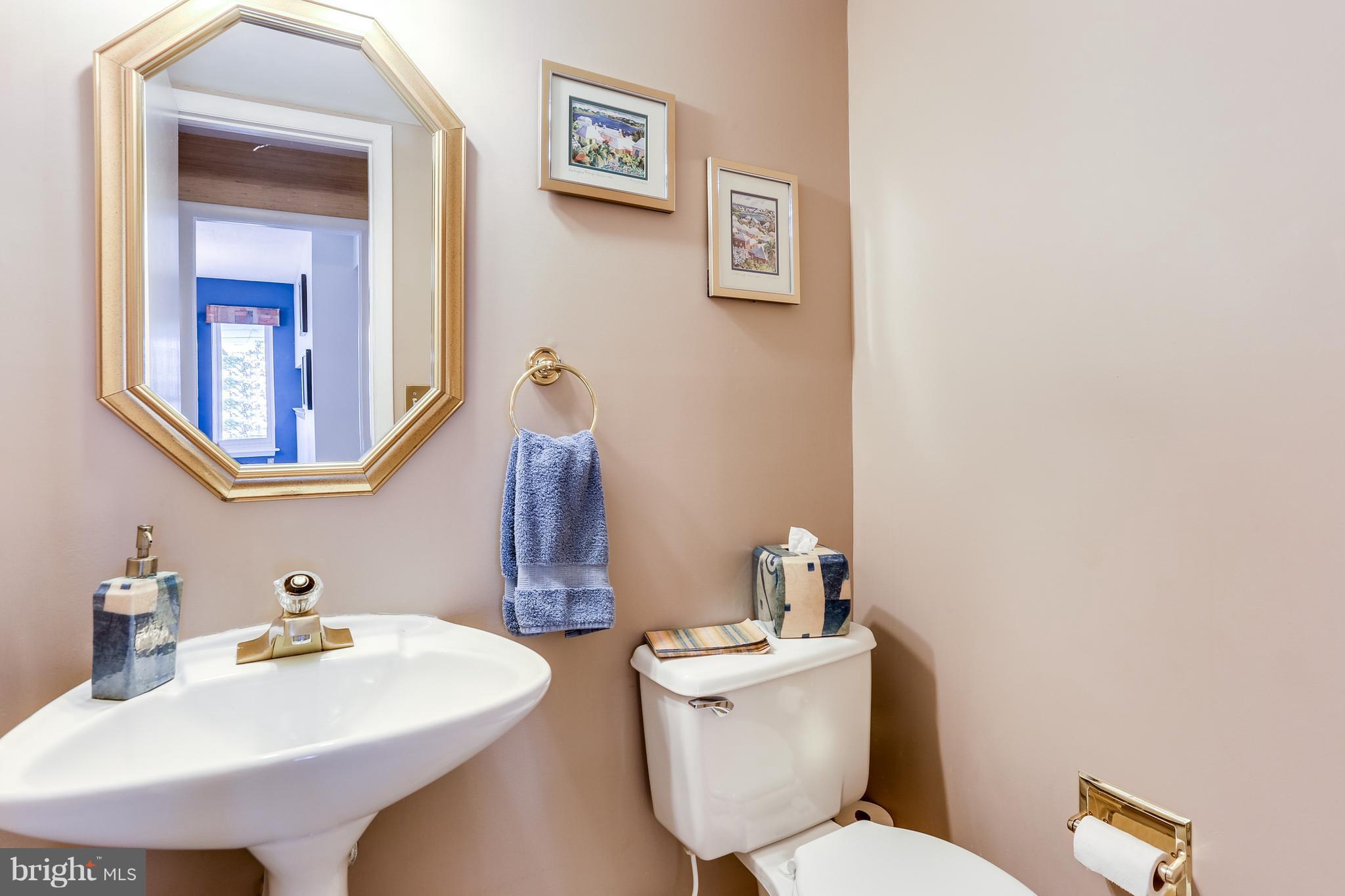 5431 Vantage Point Road Columbia, MD 21044 - Photo 12 of 29 a bathroom with a toilet sink and mirror