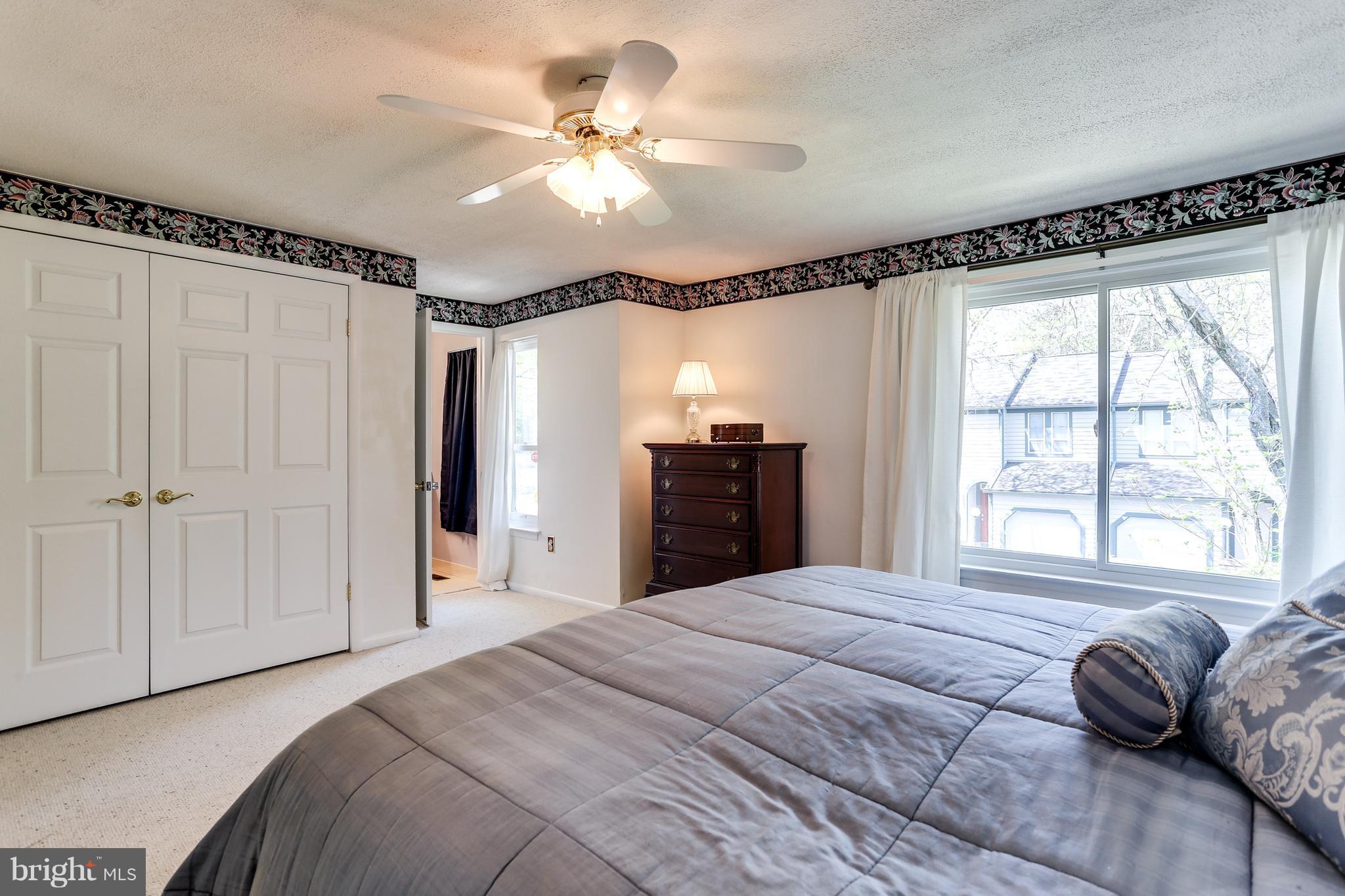 5431 Vantage Point Road Columbia, MD 21044 - Photo 15 of 29 a bedroom with a large bed and a window