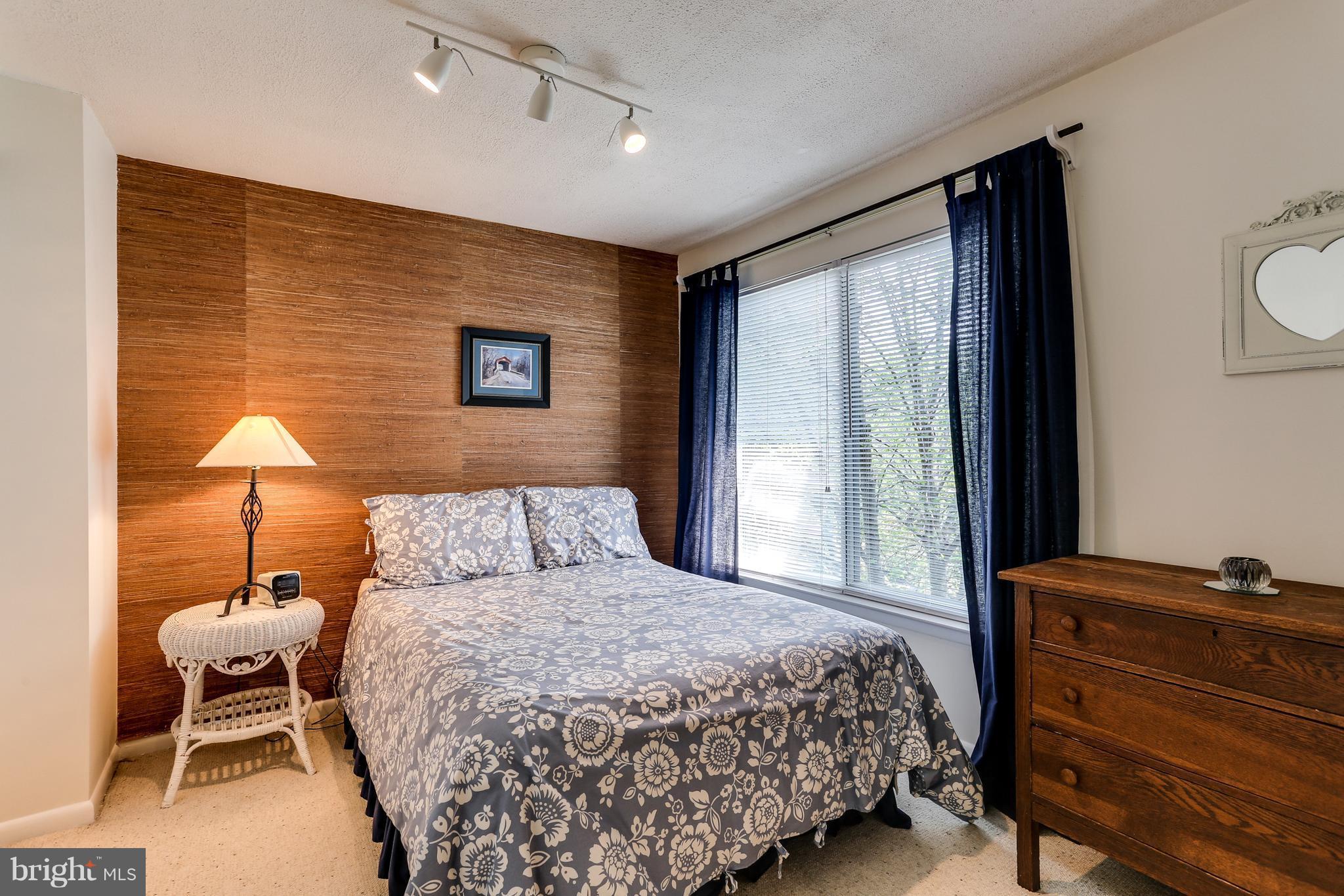 5431 Vantage Point Road Columbia, MD 21044 - Photo 17 of 29 a bedroom with a bed and a lamp