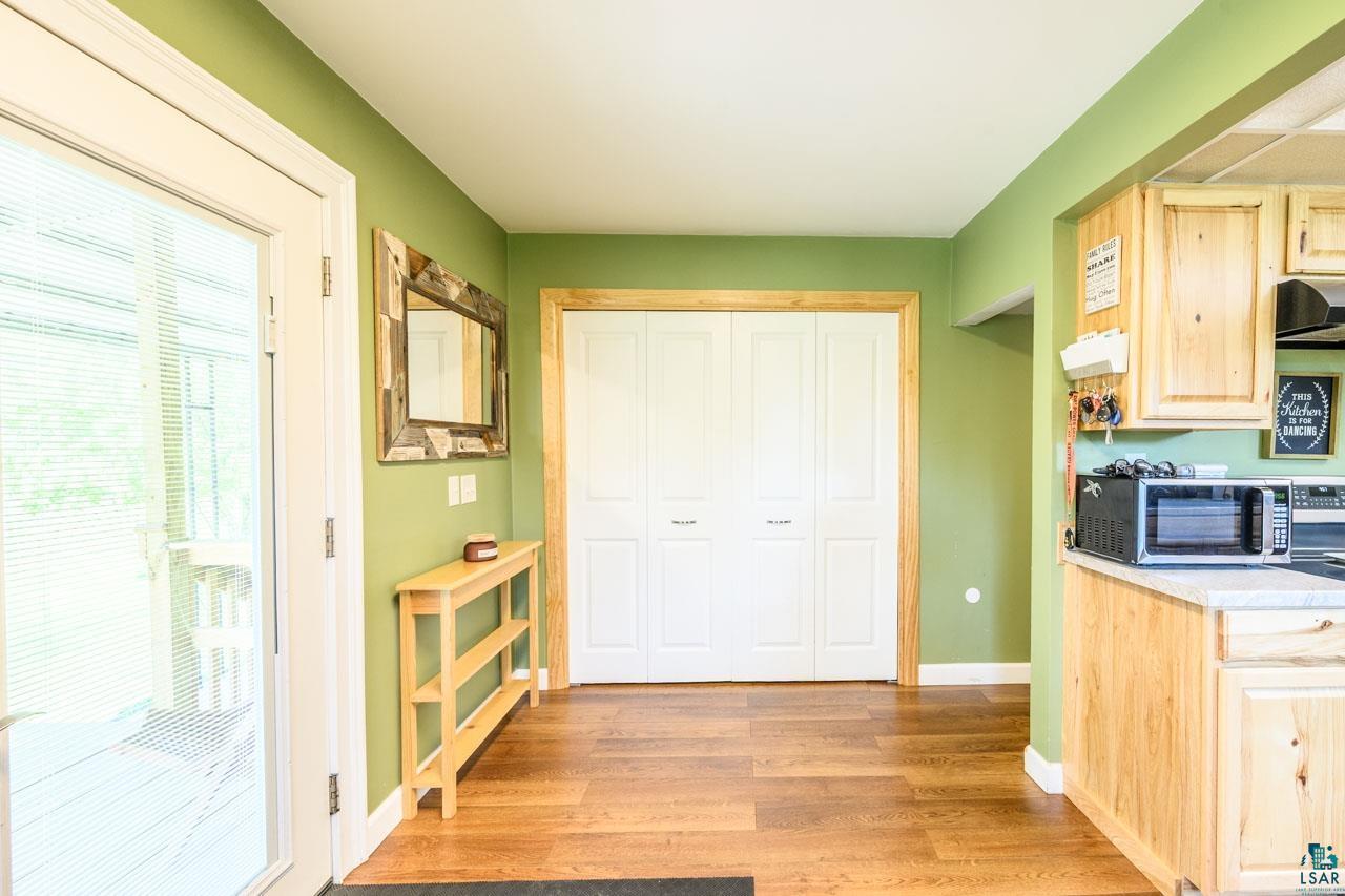 2581 O'Rourke Road Hibbing, MN 55746 - Photo 12 of 61 Wood-finish flooring throughout, complemented by light wood kitchen cabinetry and a light countertop
