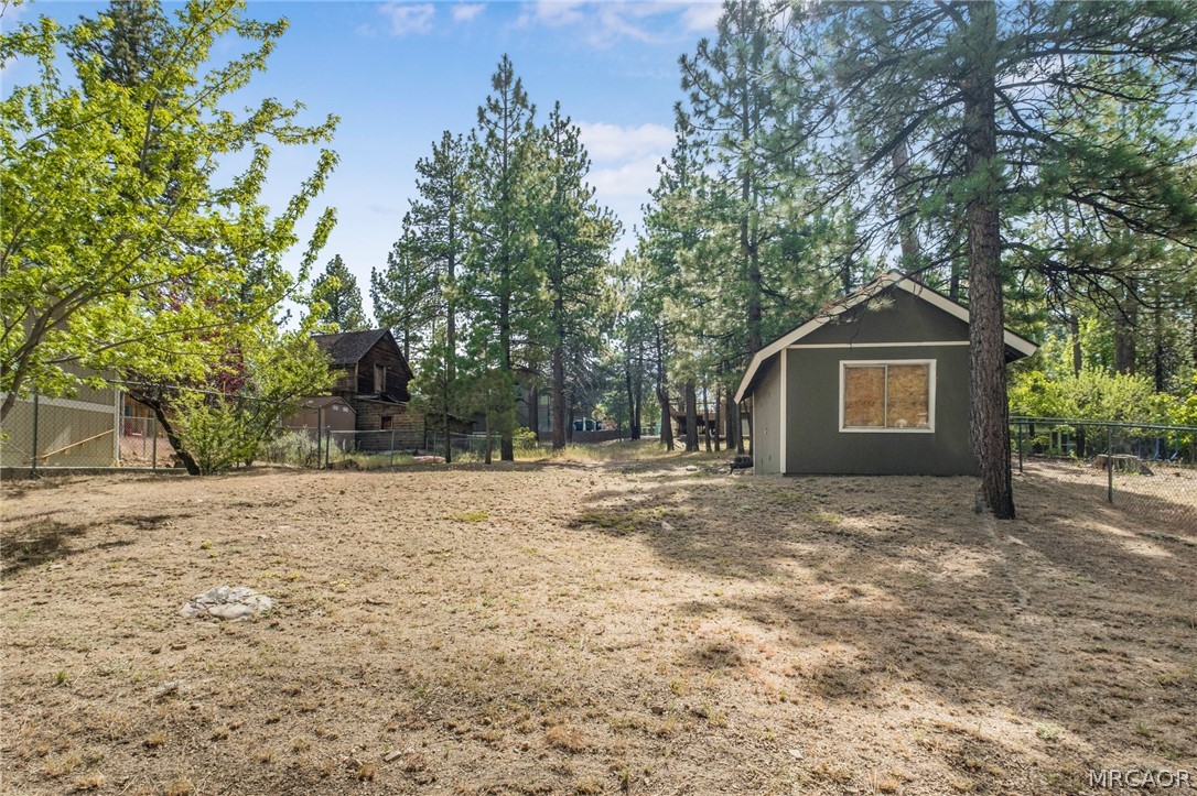 195 Elgin Road Big Bear Lake, CA 92315 - Photo 32 of 45 a view of a house with a yard and large tree