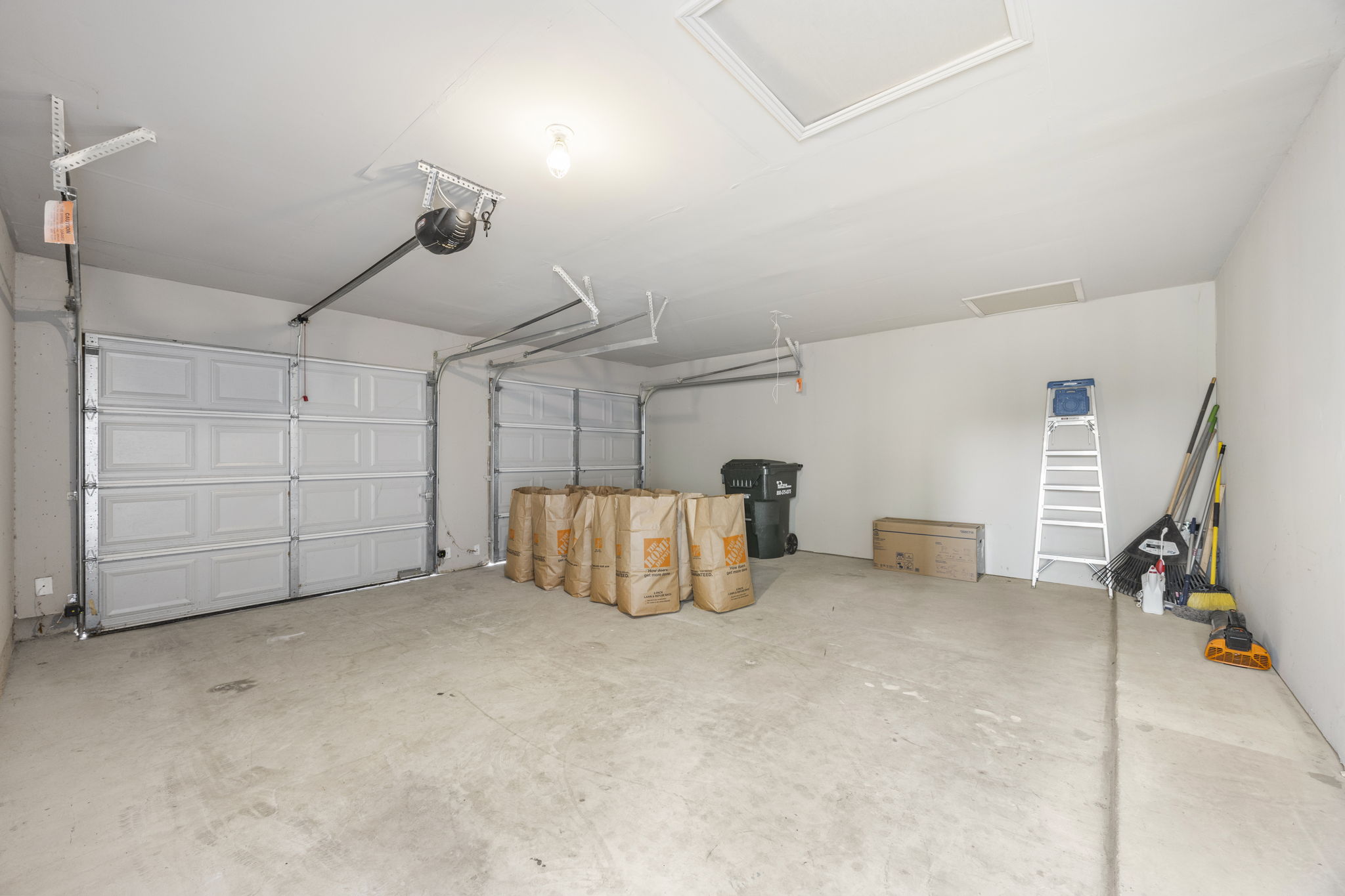 263 Cleveland Kyle, TX 78640 - Photo 18 of 20 Garage featuring a garage door opener
