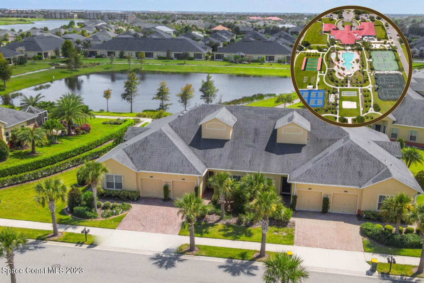 an aerial view of a house with a swimming pool patio and outdoor seating