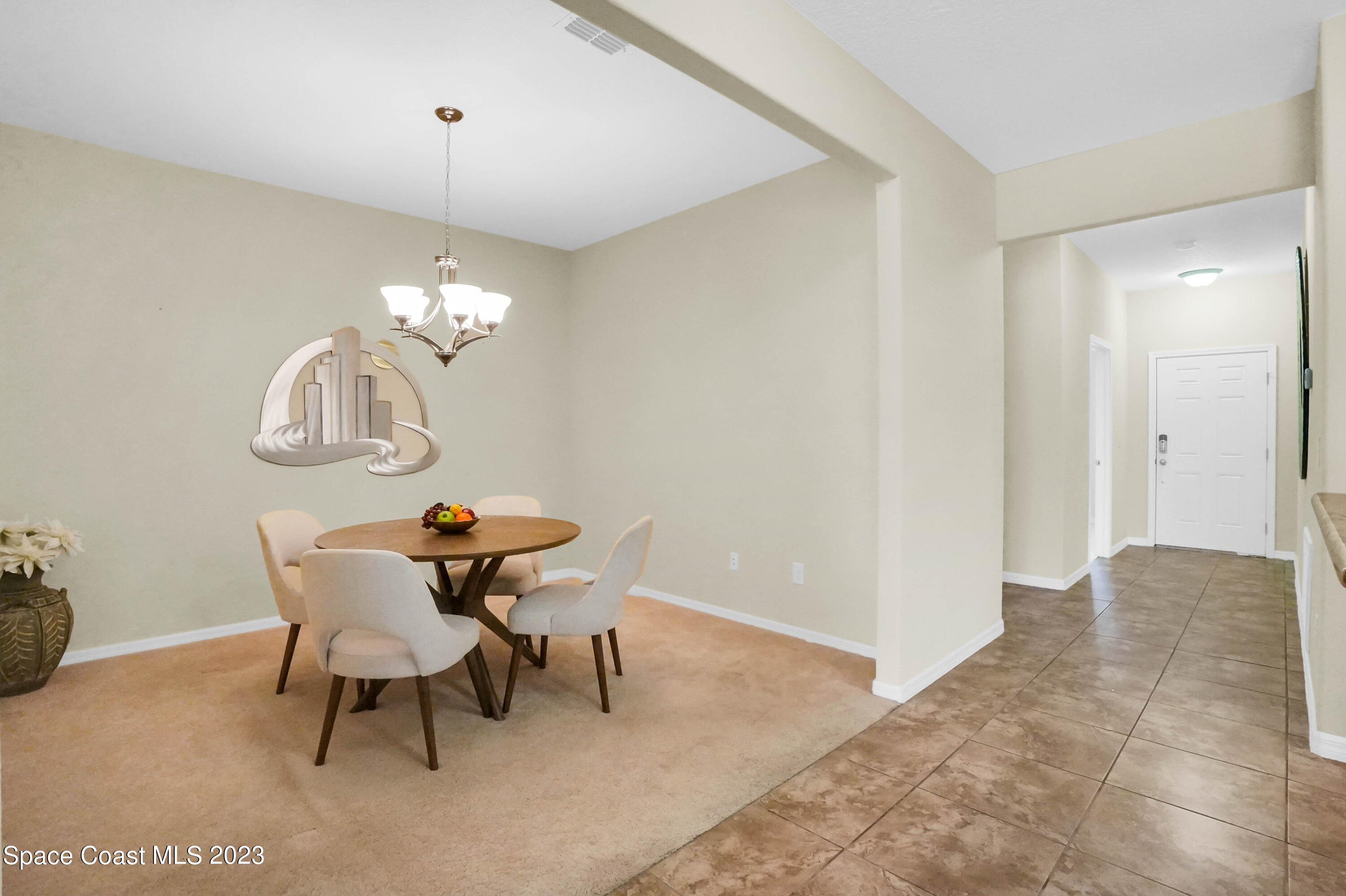 5928 Van Ness Drive Melbourne, FL 32940 - Photo 13 of 35 a view of a dining room with furniture