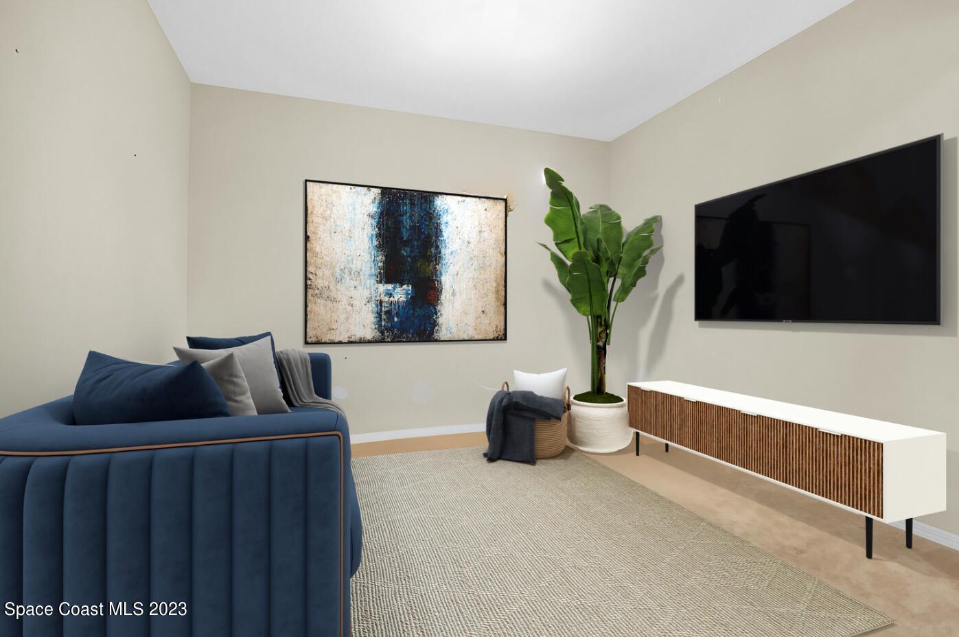 5928 Van Ness Drive Melbourne, FL 32940 - Photo 15 of 35 a living room with furniture and a flat screen tv