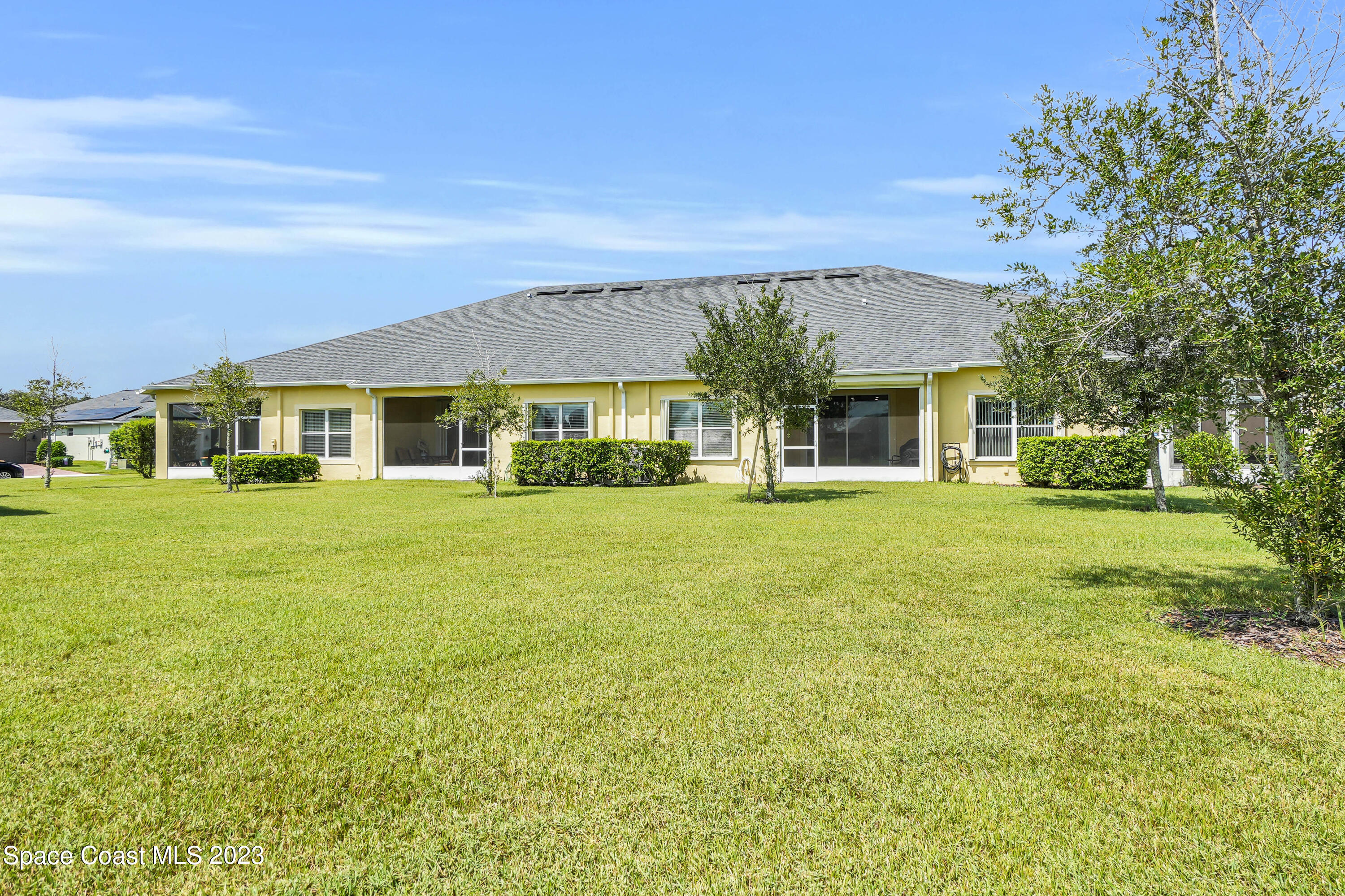 5928 Van Ness Drive Melbourne, FL 32940 - Photo 23 of 35 a front view of a house with a yard