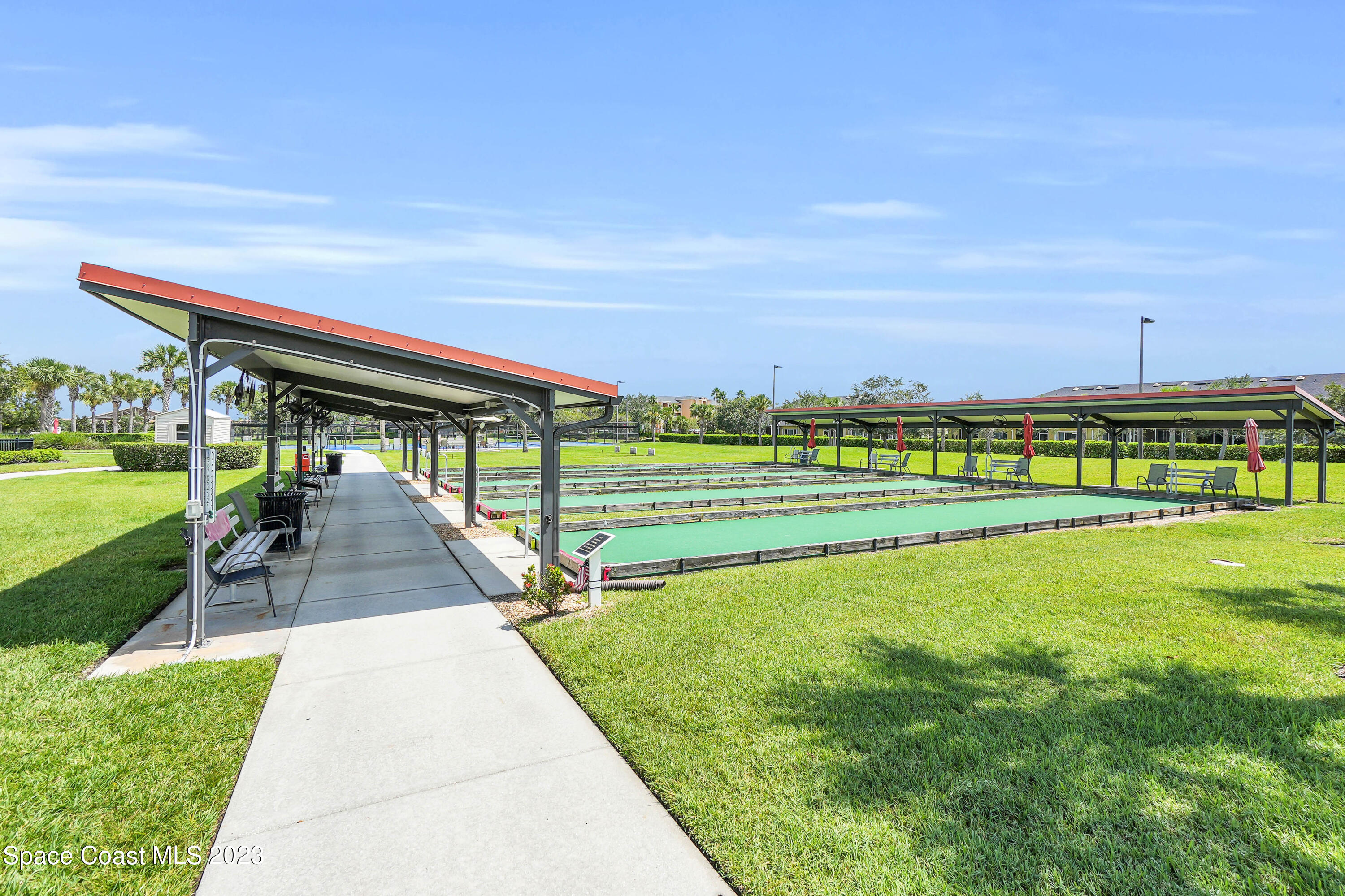 5928 Van Ness Drive Melbourne, FL 32940 - Photo 26 of 35 a view of a swimming pool and a yard